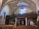 L'intérieur de l'église Saint-Christophe vers le portail.