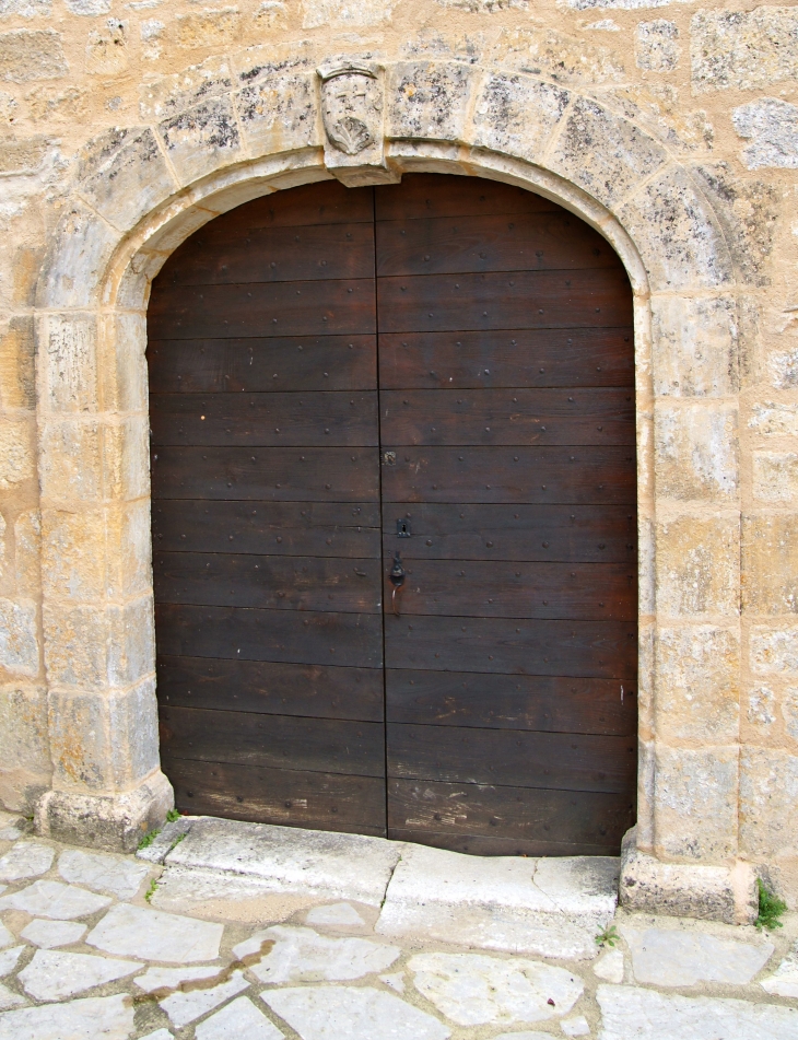 Le portail de l'église. - Coly