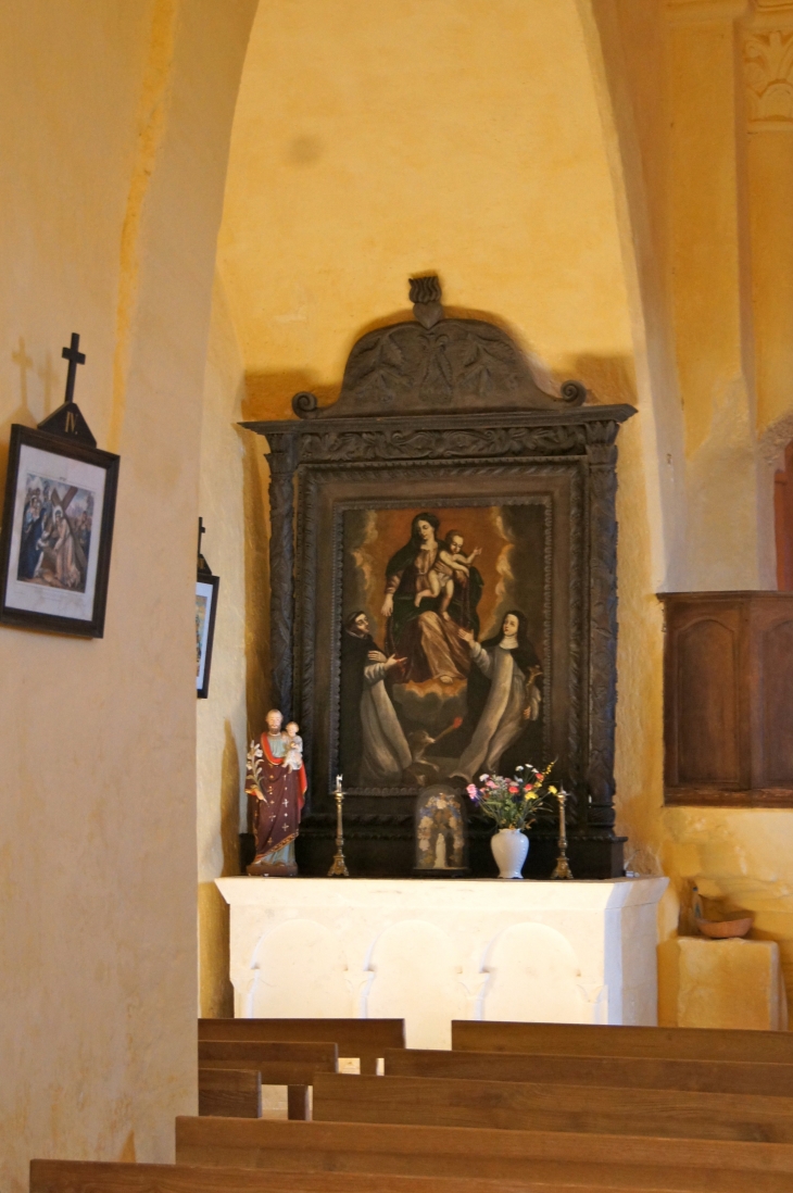 Eglise Sainte-Marie et Sainte Anne de Carlucet : dans la chapelle nord, retable en bois sculpté et tournés. - Saint-Crépin-et-Carlucet