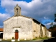 Photo suivante de Saint-Louis-en-l'Isle L'église Saint-Louis du XIIIe siècle avec clocher-mur et portail du XIXe siècle.