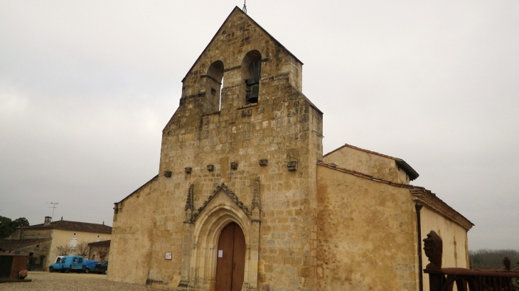 L'église romane, son clocher-mur et son portail gothique. - Ladaux