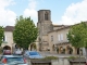 Photo suivante de Sauveterre-de-Guyenne L'église Notre-Dame vue de la place centrale.