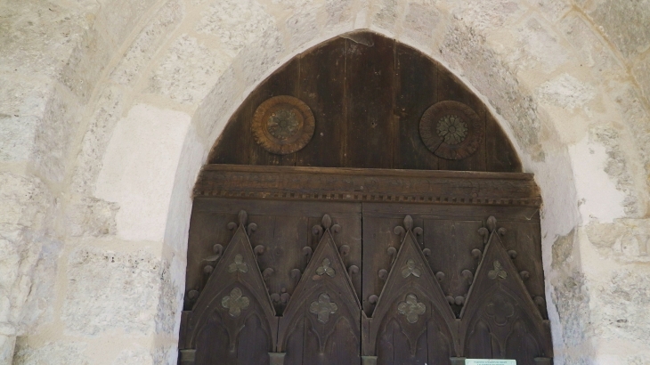 La porte ouvragée de l'église. - Saint-Astier