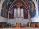 Photo précédente de Le Menoux Eglise Notre Dame : fresques modernes exécutées par Jorge Carrasco. Dans la clef de voûte du choeur, dominant les peintures murales, un antique Christ restauré a été mis en place. A droite, Carrasco a représenté les forces positives de la nature, à gauche