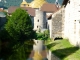 Photo précédente de Salins-les-Bains Reflet de Notre Dame Libératrice dans la furieuse à l'arrière des Salines.