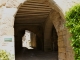 Photo suivante de Saint-Côme-d'Olt Entrée dans le village par la porte de la maison de Caylus.