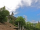 Photo précédente de Saint-Geniez-d'Olt Du cimetière, le monument Talabot et le clocher de l'église saint Geniez.