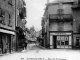 Photo suivante de Saint-Geniez-d'Olt Rue du Commerce, vers 1905 (carte postale ancienne).