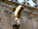 Photo suivante de Évron Personnage grimaçant pour soutenir une gargouille. Basilique.