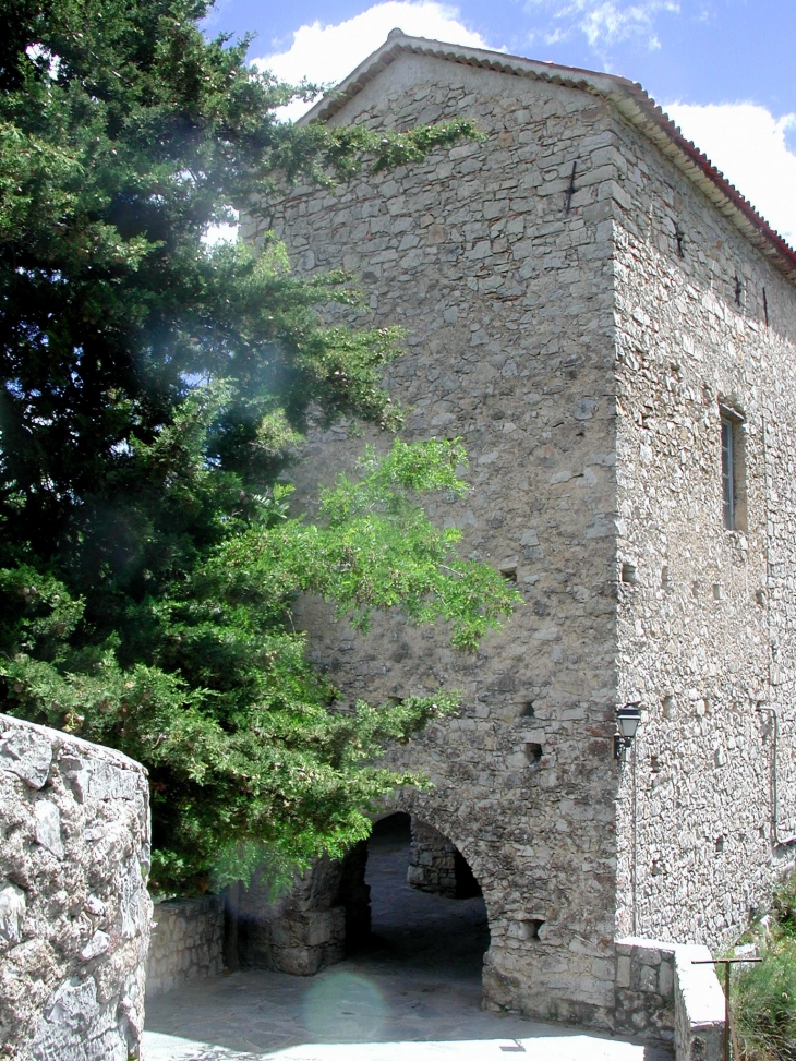 L'église coté Nord  avec l'entrès du passage en  - Bairols