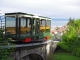 Photo suivante de Thonon-les-Bains Le funiculaire Rives-Thonon.  C'est le deuxième funiculaire construit en France après celui de Saint- Just à Lyon.   Conçu par l’ingénieur Auguste Alesmonières, le funiculaire a la particularité d’avoir le croisement des voitures dans une courbe. 