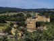 Photo suivante de Jarnioux Vue sur l'église et le château de Jarnioux