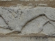 Photo suivante de Pommiers Lion, la queue entre les pattes sur la façade de l'Eglise Saint-Barthélémy